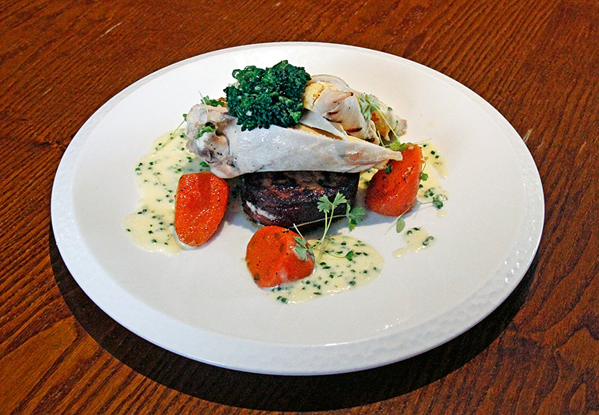 Chicken breast stuffed with butternut squash mousse, potato fondant, carrots and parmesan cream sauce