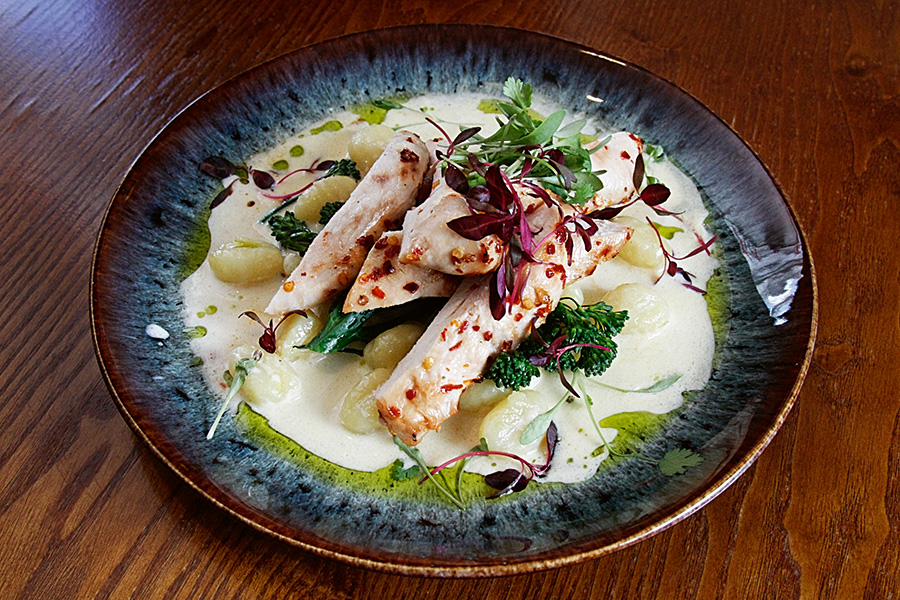 Garlic chilli chicken with parmesan cream, gnocchi and seasonal tenderstem broccoli