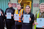 Junior members with their Certificates of Achievement  prior to a Halloween event in 2024