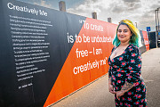 Farah Nisa next to her poem  ‘Creatively Me’