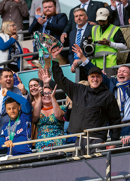 Jimmy McNulty lifts the National League Promotion Final Trophy at Wembley