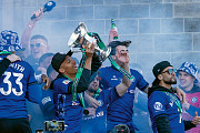 Kyron Gordon lifts the National League Promotion Final Trophy