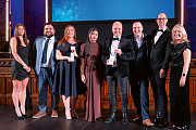 The Number One Riverside reception team and the  financial affairs team, winners of the passionate about  excellence award, presented by Jaime Dawson from  Willmott Dixon (left) and interim chief executive  of Rochdale Council Julie Murphy (right)